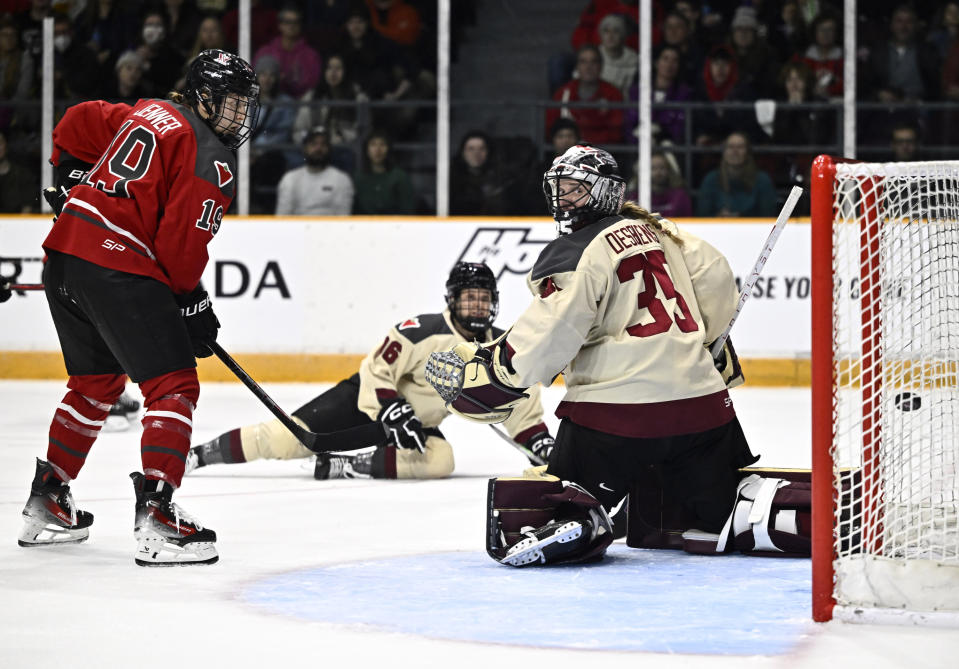 Ottawa's Brianne Jenner (19) watches as the puck goes into the net behind Montreal's Ann-Renee Desbiens (35) on a shot by Ottawa's Hayley Scamurra, not seen, during the second period of a PWHL hockey game Tuesday, Jan. 2, 2024, in Ottawa, Ontario. (Justin Tang/The Canadian Press via AP)