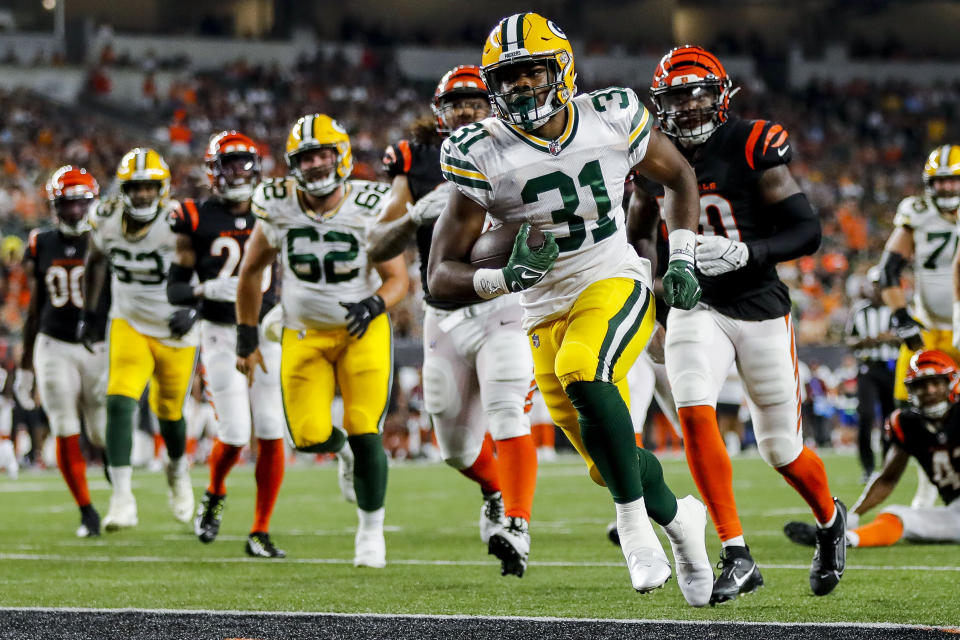 Aug 11, 2023; Cincinnati, Ohio, USA; Green Bay Packers running back Emanuel Wilson (31) runs for a touchdown against the Cincinnati Bengals in the second half at Paycor Stadium. Mandatory Credit: Katie Stratman-USA TODAY Sports