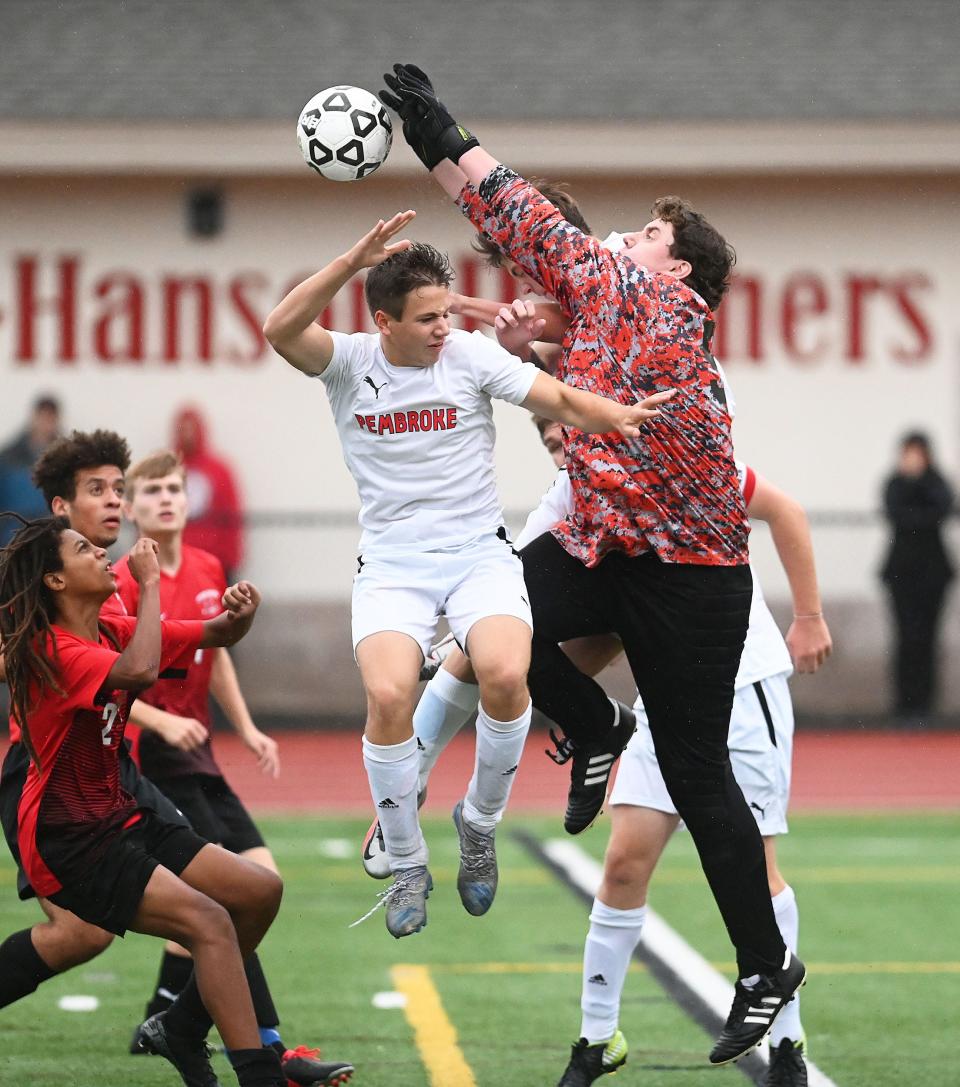 Whitman-Hanson goalkeeper Ethan Smith makes the save on Pembroke's Wil McManus, during a game on Monday, Oct. 4, 2021.