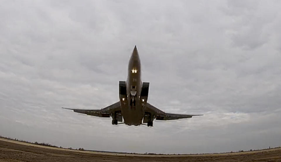 FILE - In this photo taken from video and released by Russian Defense Ministry Press Service on Nov. 10, 2021, a long-range Tu-22M3 bomber of the Russian Aerospace Forces takes-off to patrol in the airspace of Belarus, from an airfield in Russia. Russia is planning massive drills of its strategic military forces that provide a stark reminder of the country's nuclear might. The Russian Defense Ministry announced the war games on Friday amid Western fears that Moscow might be preparing to invade Ukraine. (Russian Defense Ministry Press Service via AP, File)