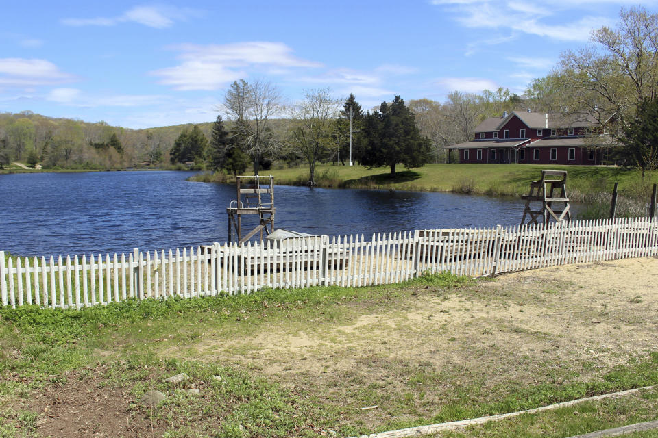 The Deer Lake Boy Scout Reservation in Killingworth, Conn., sits empty, Wednesday, May 11, 2022. The camp is among many nationwide being sold by local councils as membership dwindles and the organization raises money to pay sexual abuse victims as part of a bankruptcy settlement. Conservationists, government officials and others are scrambling to find ways to preserve them as open space. (AP Photo/Pat Eaton-Robb)