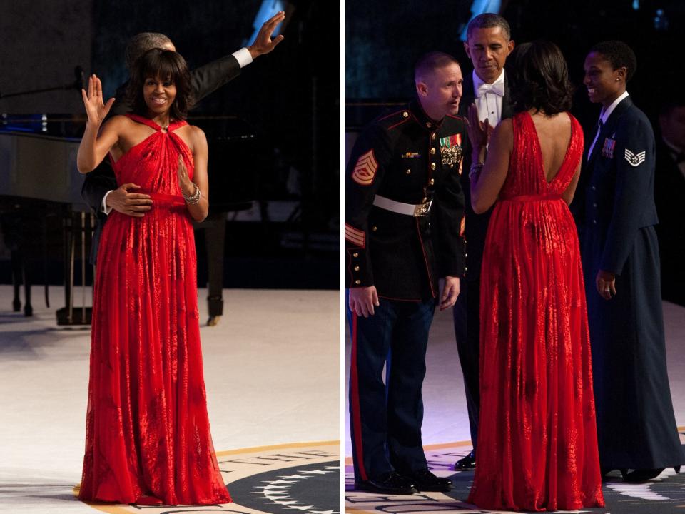 Michelle Obama wears a red halter dress at an inaugural ball in 2013