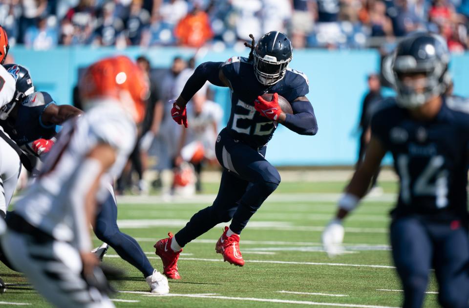 Tennessee Titans running back <a class="link " href="https://sports.yahoo.com/nfl/players/29279" data-i13n="sec:content-canvas;subsec:anchor_text;elm:context_link" data-ylk="slk:Derrick Henry;sec:content-canvas;subsec:anchor_text;elm:context_link;itc:0">Derrick Henry</a> (22) breaks off a big run against the Cincinnati Bengals in the final minutes at Nissan Stadium in Nashville, Tenn., Sunday, Oct. 1, 2023.