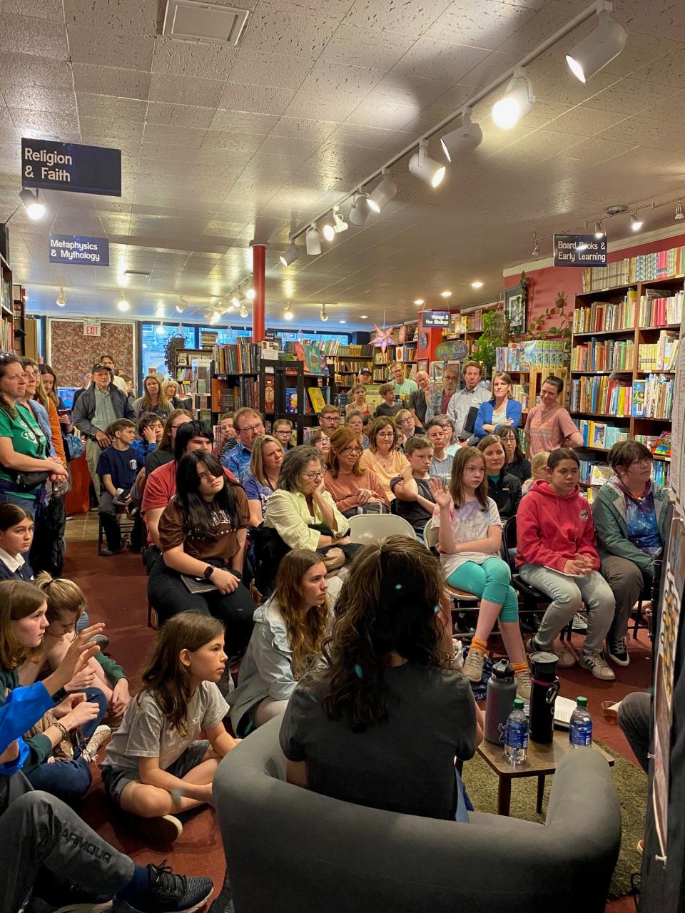 Members of the Kutztown Teen Banned Book Club and others gather at the Firefly Book Story on April 15, 2023, for a book signing and Q&A session with author Alan Kratz.