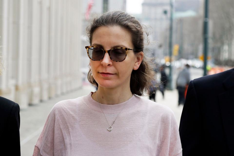 Clare Bronfman, center, a member of NXIVM, an organization charged with sex trafficking, arrives at Brooklyn Federal Court, Monday, April 8, 2019, in New York.