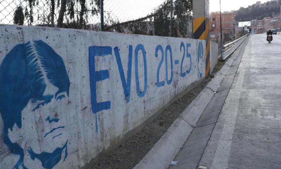 A graffiti of the former president Evo Morales in La Paz. The exiled Morales still overshadows Bolivian politics.