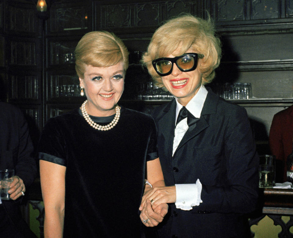 FILE - Anglea Lansbury, left, and Carol Channing appear at a party at Sardis in New York on March 16, 1967. Lansbury, the big-eyed, scene-stealing British actress who kicked up her heels in the Broadway musicals “Mame” and “Gypsy” and solved endless murders as crime novelist Jessica Fletcher in the long-running TV series “Murder, She Wrote,” died peacefully at her home in Los Angeles on Tuesday. She was 96. (AP Photo/John Duricka, File)