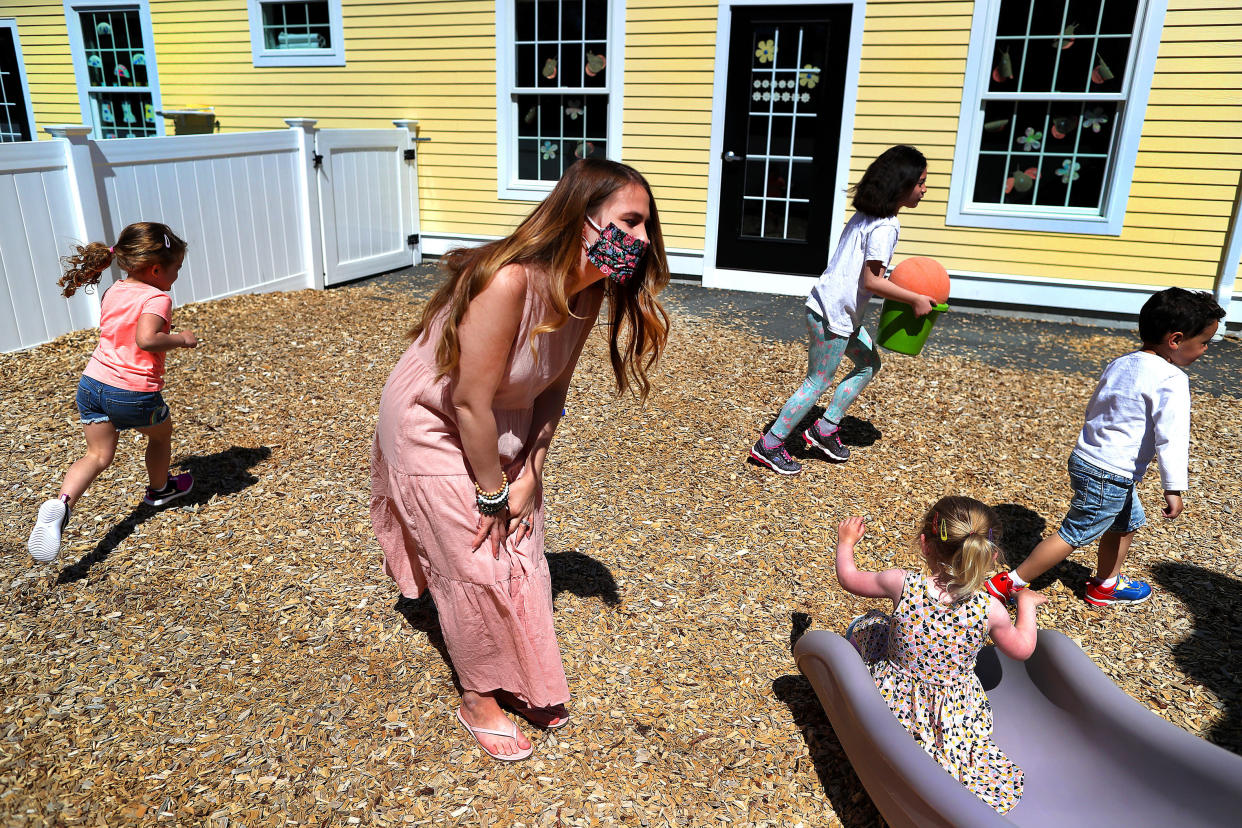 Preschool teacher Jenna Grenier keeps an eye on the children at Magical Beginnings Learning Academy in Middleton, Massachusetts, on May 22, 2020.  (Photo: John Tlumacki/The Boston Globe via Getty Images)