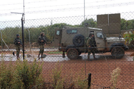 Israeli soldiers patrol near the Lebanese-Israeli border as seen from the southern Lebanese village of Kfar Kila, November 21, 2017.REUTERS/ Karamallah Daher