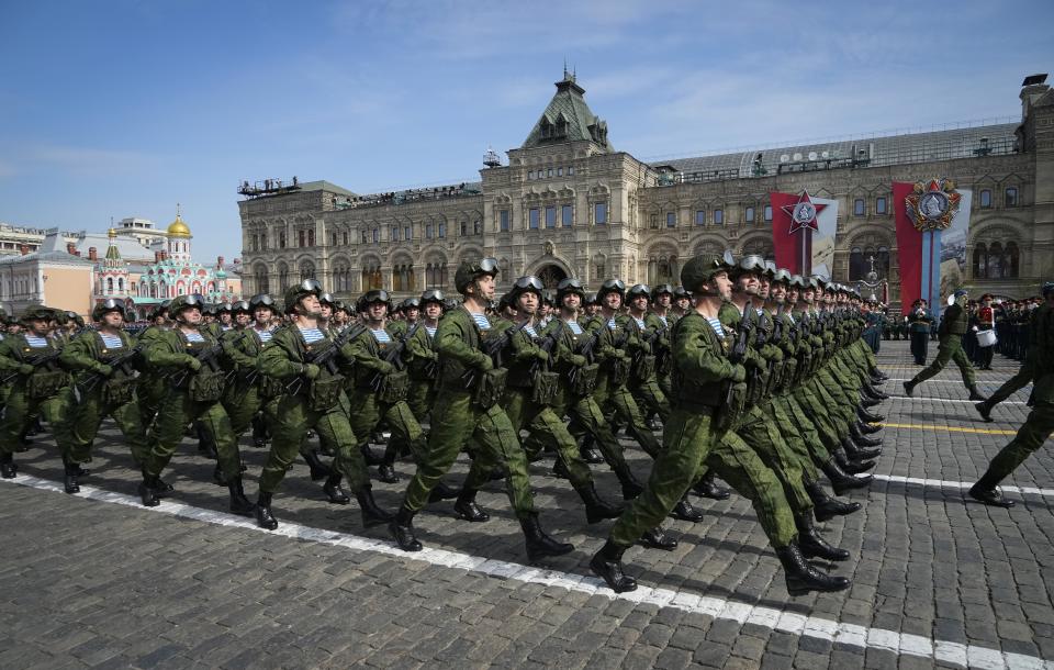 FILE - Russian servicemen march during a dress rehearsal for the Victory Day military parade in Moscow, Russia, Saturday, May 7, 2022. The parade will take place at Moscow's Red Square on May 9 to celebrate 77 years of the victory in WWII. In Russia, history has long become a propaganda tool used to advance the Kremlin's political goals. In an effort to rally people around the flag, the authorities have sought to magnify the country's past victories while glossing over the more sordid chapters of its history. (AP Photo/Alexander Zemlianichenko, File)