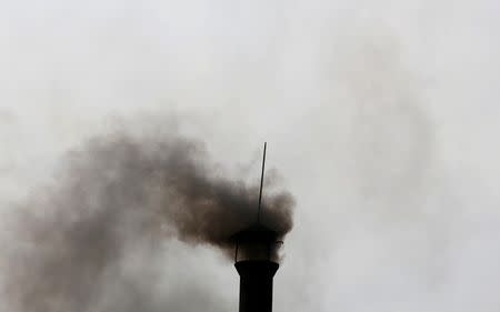 Smoke rises from the chimney of a paper factory outside Hanoi, Vietnam May 21, 2018. Picture taken May 21, 2018. REUTERS/Kham