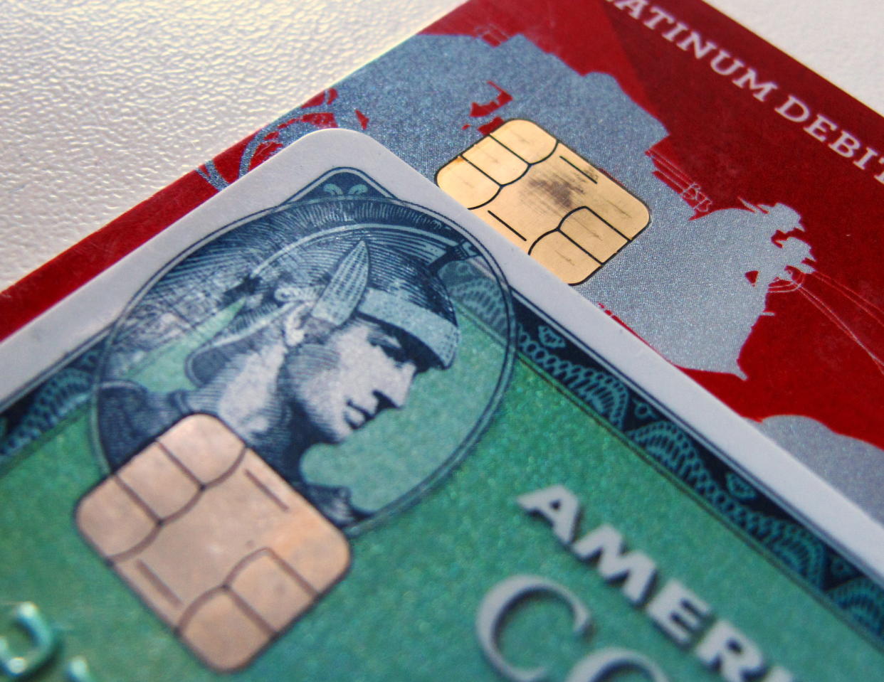 Computer chips are seen on newly-issued credit cards in this photo illustration taken in Encinitas, California September 28, 2015. In an effort to reduce counterfeit and credit card fraud more than 200 million payment cards have been issued with embedded computer chips in the U.S., ahead of a Oct. 1 deadline for the switch to such cards, according to the Smart Card Alliance. Credit card companies have set the October deadline which will require U.S. consumers to carry a new kind of card and retailers across the nation to upgrade payment terminals.  REUTERS/Mike Blake