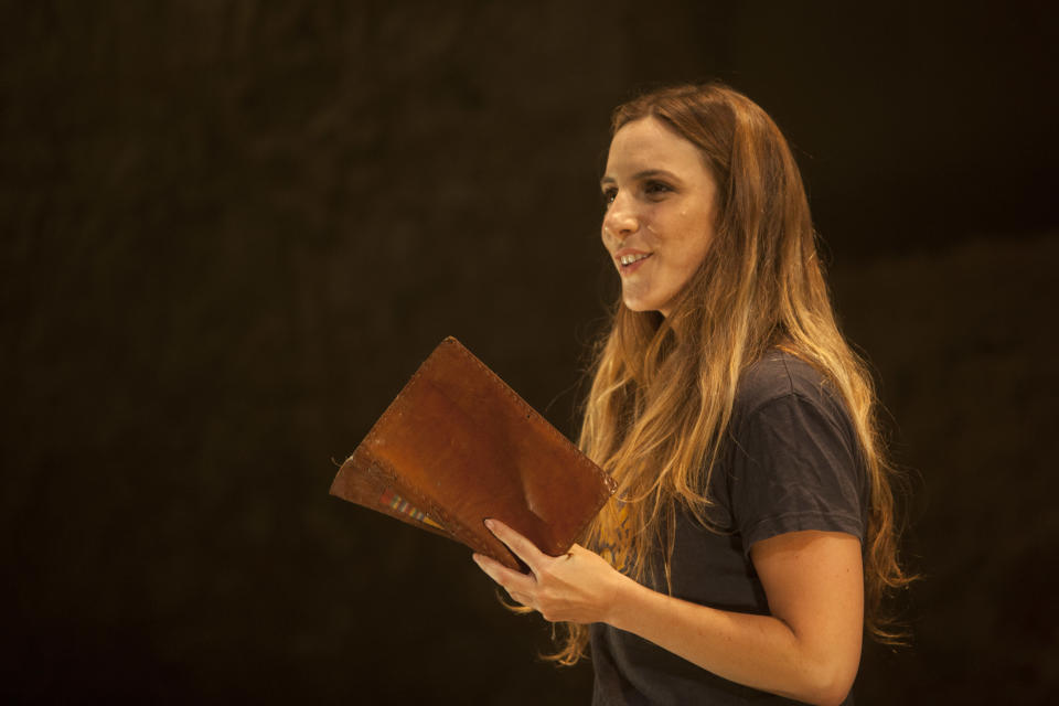 In this photo taken Sunday, July 7, 2013. Israeli actress Sivane Kretchner plays American activist Rachel Corrie as she performs in a theater in Jerusalem. A one-person play about an American activist who was crushed to death by an Israeli military bulldozer is being performed for a Hebrew-speaking audience in Jerusalem. (AP Photo/Sebastian Scheiner)