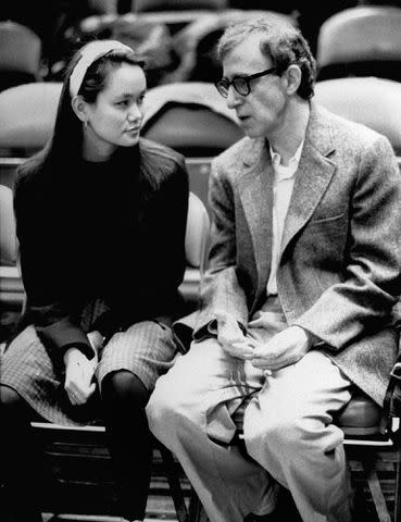 <p>John Roca, John/NY Daily News/Getty</p> Woody Allen and Soon-Yi Previn at a New York Knicks game in March 1990