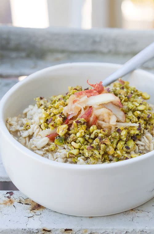 Coconut and pear bircher oats with grated apple and crushed pistachios