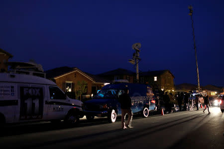 News crews gather outside the home of David Allen and Louise Anna Turpin in Perris, California, U.S., January 15, 2018. REUTERS/Mike Blake
