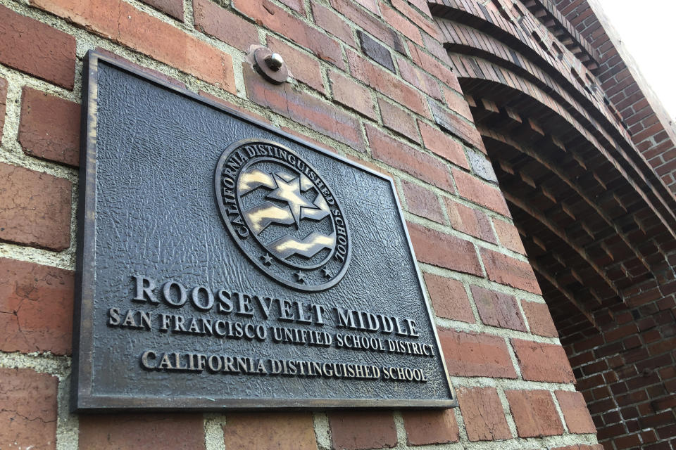 A plaque for Roosevelt Middle School is seen outside the school in San Francisco, on Wednesday, Jan. 27, 2021. The San Francisco school board voted Tuesday, Jan. 26, to remove the names of George Washington and Abraham Lincoln from public schools after officials deemed them and other prominent figures, including Sen. Dianne Feinstein, unworthy of the honor. Critics called the process slapdash, with little to no input from historians and a lack of information on the basis for each recommendation. In one instance, the committee didn't know whether Roosevelt Middle School was named after Theodore or Franklin Delano. (AP Photo/Haven Daley)