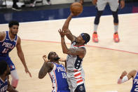 Washington Wizards guard Bradley Beal (3) goes to the basket against Philadelphia 76ers guard Shake Milton (18) during the first half of Game 3 in a first-round NBA basketball playoff series, Saturday, May 29, 2021, in Washington. Milton was called for a foul on the play. (AP Photo/Nick Wass)