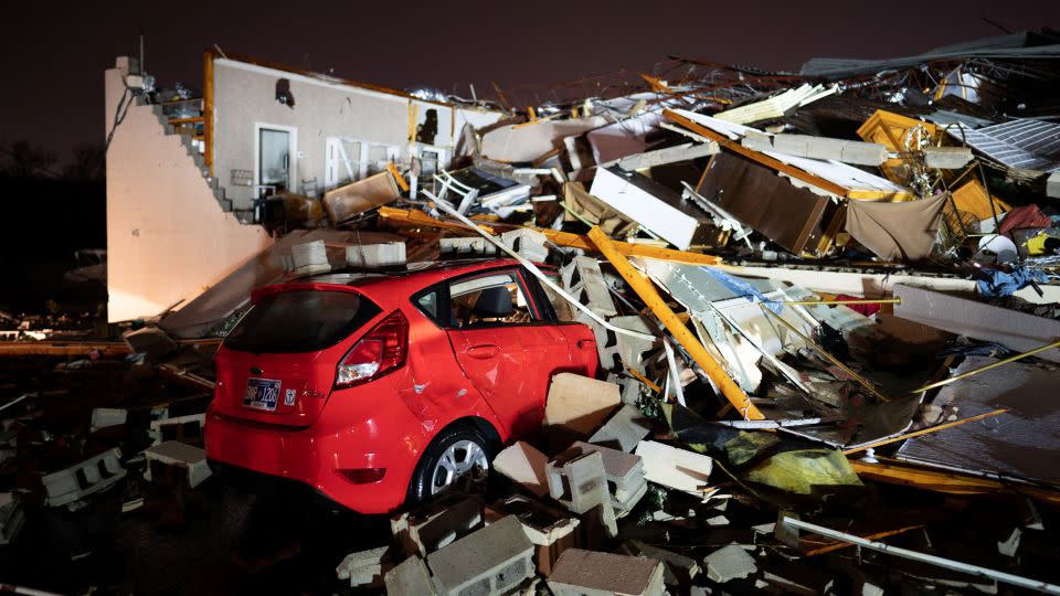 A car is buried under rubble on Main Street after a tornado hit Hendersonville, Tennessee on Saturday. - Andrew Nelles/USA Today Network/Reuters