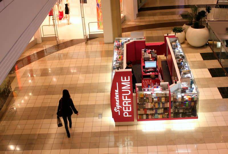 A woman walks through a shopping mall in San Francisco