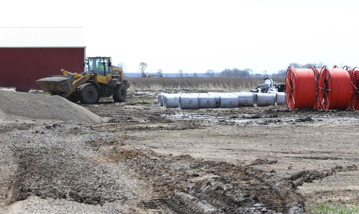 Crews perform excavation work Tuesday, April 9, 2024, on Fillmore Road west of Larrison Boulevard near New Carlisle.