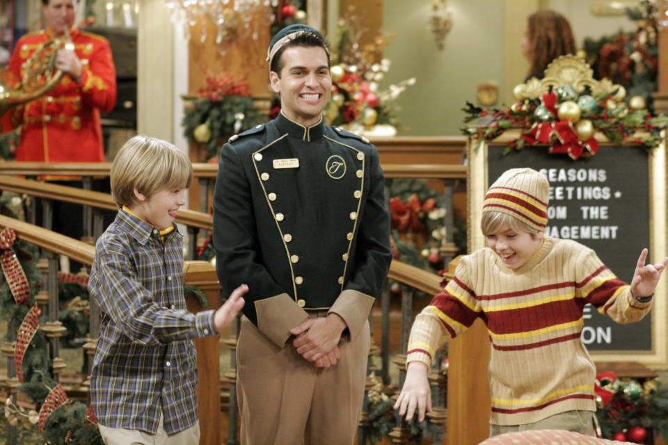 Esteban smiling next to Zack and Cody