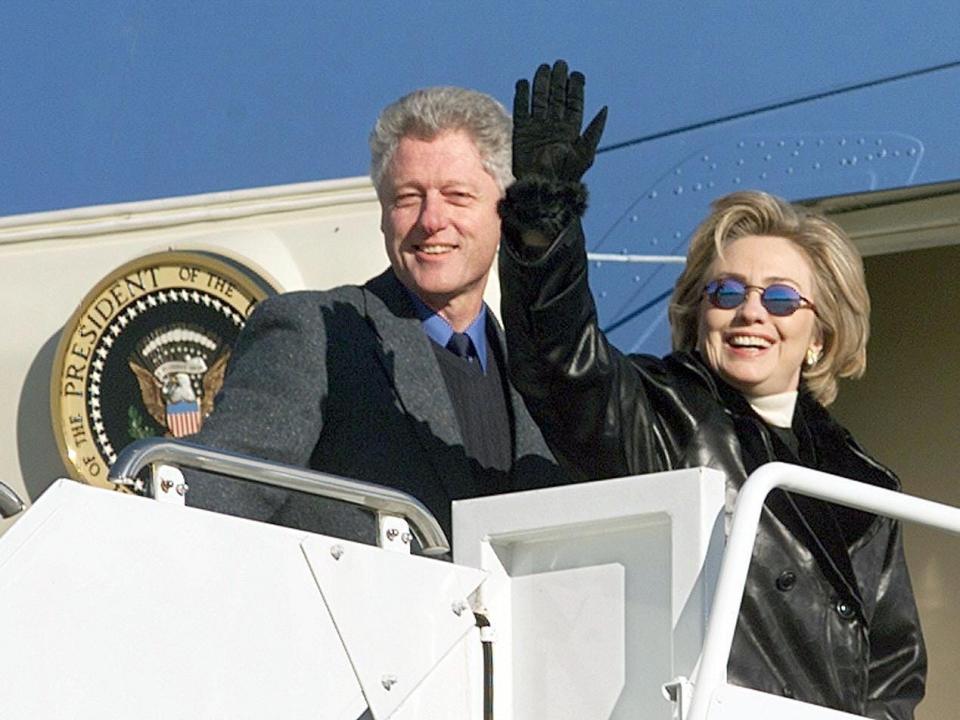 Former President Bill Clinton (L) and First Lady Hillary Rodham Clinton depart Andrews Air Force Base, MD, for a three day family vacation in Hilton Head, SC with their daughter Chelsea 30 December. The Clintons are scheduled to attend the annual Renaissance Weekend family retreat in Hilton Head.