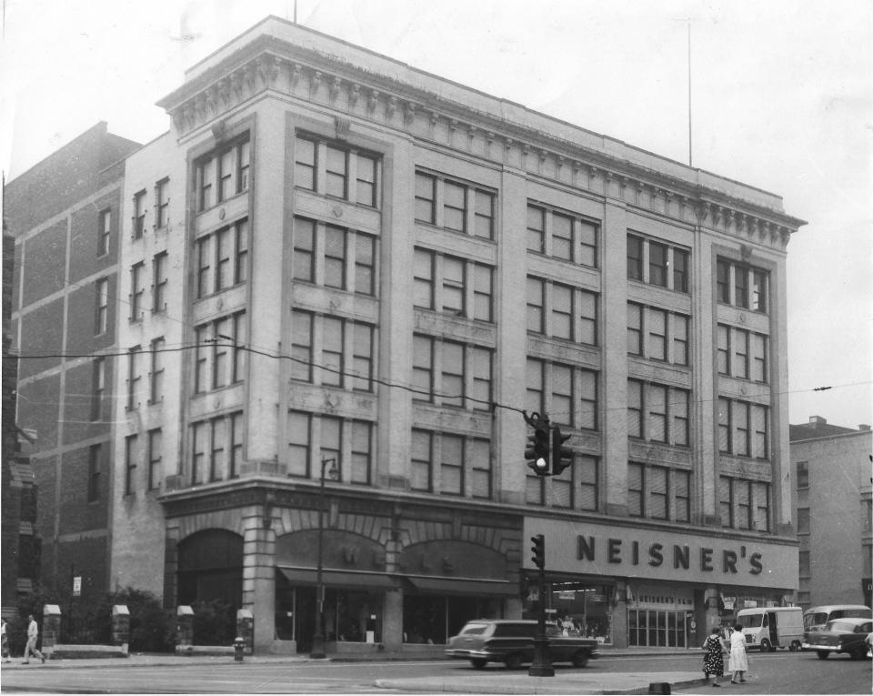 J.B. Wells & Son (on the left) was a “quality department store” and its neighbor, Neisner’s, was a “5 cents to a $1” variety store. They were located on the east side of Genesee Street in downtown Utica between Elizabeth and Devereux streets. Wells had 35 departments on its five floors. It was founded by John Breed Wells in 1841. Neisner’s was founded in 1910 in Rochester by Abraham and Joseph Neisner. It opened its store in Utica in 1930. It occupied the ground floor and a basement where there was a toy and hardware department, a beauty salon and shoe repair shop. A lunch counter also was in the basement and later moved upstairs. When the two stores closed, the building became the home of the Macartovin Apartments.