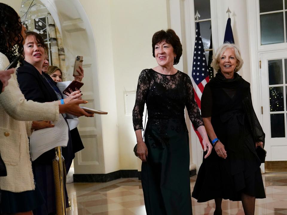Sen. Susan Collins, R-Maine, and Elizabeth McCandless arrive for the State Dinner with President Joe Biden and French President Emmanuel Macron at the White House in Washington, Thursday, Dec. 1, 2022.
