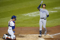 Tampa Bay Rays' Brandon Lowe celebrates as he reaches home plate after hitting a home run as New York Mets catcher Wilson Ramos, left, watches during the fourth inning of a baseball game Monday, Sept. 21, 2020, in New York. (AP Photo/Frank Franklin II)