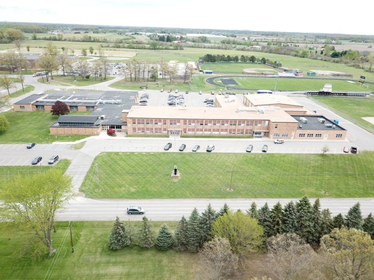 An overhead image of the current Airport Community Schools campus is shown.