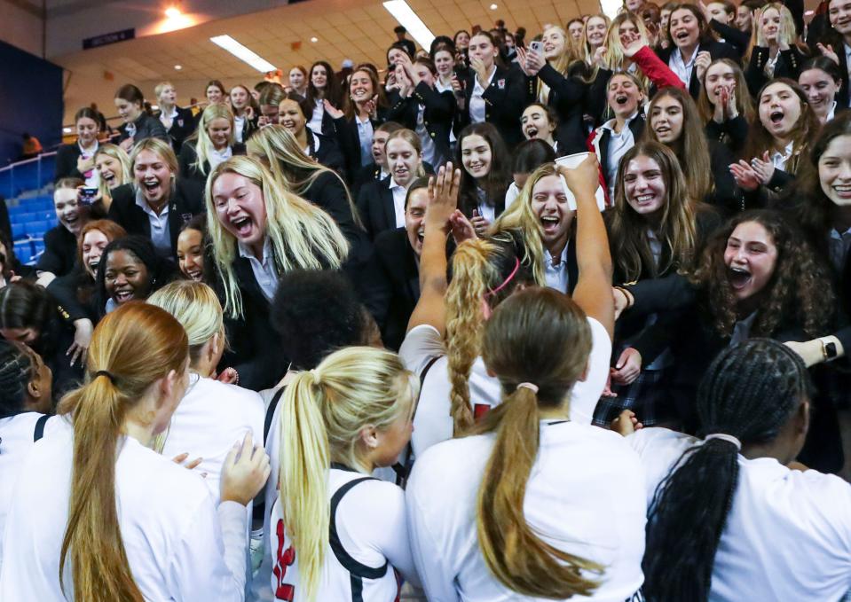 Ursuline celebrates with the student sections after the Raiders' 37-34 win against Sanford in a DIAA state tournament semifinal at the Bob Carpenter Center, Wednesday, March 6, 2024.