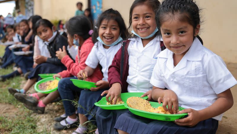 Madelyn Sofia Mendez Mateo (far right), a first-grade student in Planes de Rio Grande, Honduras, eats her meal during recess time with her classmates. “I love it when they serve spaghetti, tortillas, beans and rice,” said Sofía, who dreams of becoming a teacher or an engineer. The Church of Jesus Christ is supporting the efforts of Catholic Relief Services in various countries to provide girls and young women with nutrition education and counseling, micronutrient supplements and nutritious foods.