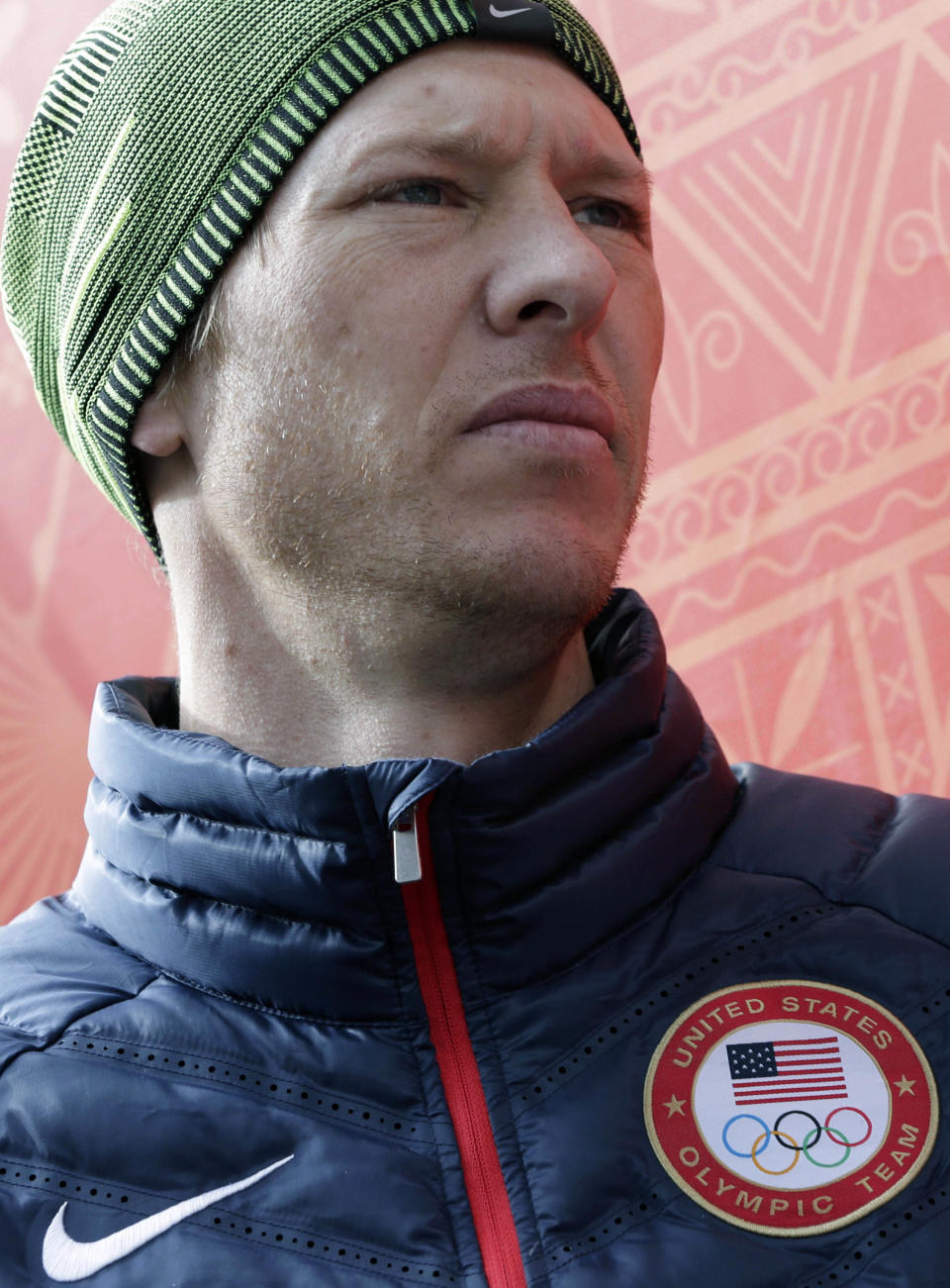 Todd Lodwick of the United States listens to questions from journalists during a men's nordic combined training session in the ski jumping stadium at the 2014 Winter Olympics, Monday, Feb. 10, 2014, in Krasnaya Polyana, Russia. (AP Photo/Matthias Schrader)