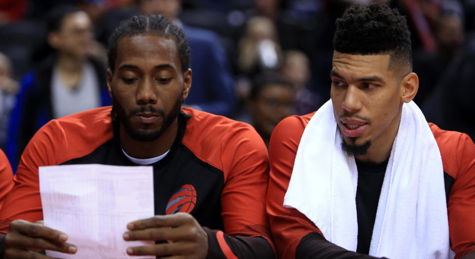 Kawhi Leonard and Danny Green are looking over some trick plays, probably. (Photo by Vaughn Ridley/Getty Images)