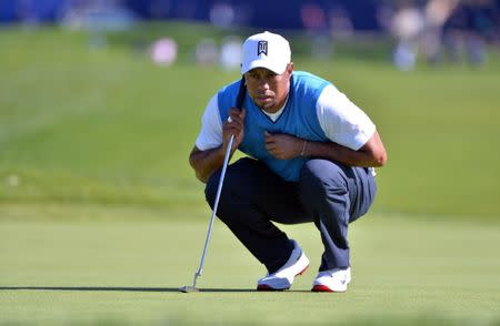 FILE PHOTO: Jan 26, 2017; La Jolla, CA, USA; Tiger Woods lines up a putt on the 1st green during the first round of the Farmers Insurance Open golf tournament at Torrey Pines Municipal Golf Course. Mandatory Credit: Orlando Ramirez-USA TODAY Sports