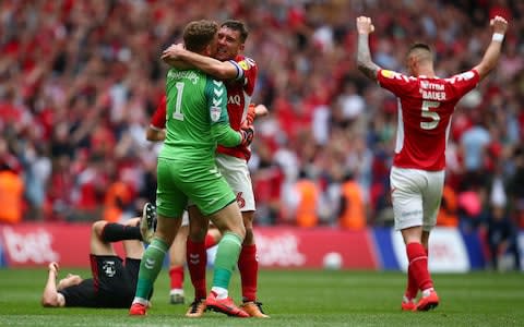  Dillon Phillips, Patrick Bauer and Jason Pearce of Charlton Athletic celebrate victory at the final whistle during the Sky Bet League One Play-off Final  - Credit: Charlie Crowhurst/Getty Images