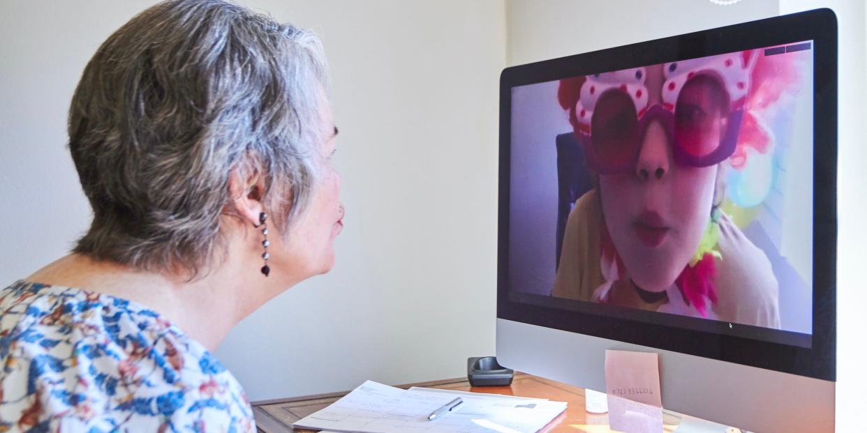 grandma video call with grandchild desktop video conference