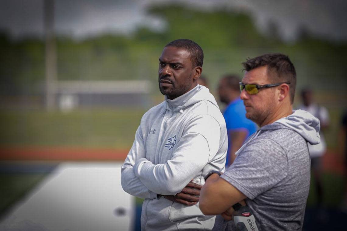 College coaches survey the field for future recruits at the High School football prospect day recruiting showcase at Hickory Ridge High School Kelly Hood