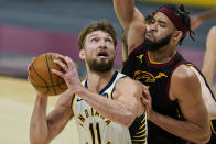 Indiana Pacers' Domantas Sabonis (11) looks to shoot against Cleveland Cavaliers' JaVale McGee during the second half of an NBA basketball game Wednesday, March 3, 2021, in Cleveland. (AP Photo/Tony Dejak)