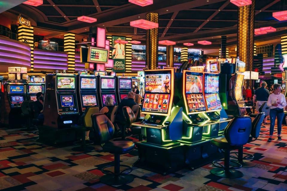 A casino and Las Vegas filled with slot machines lit up at night