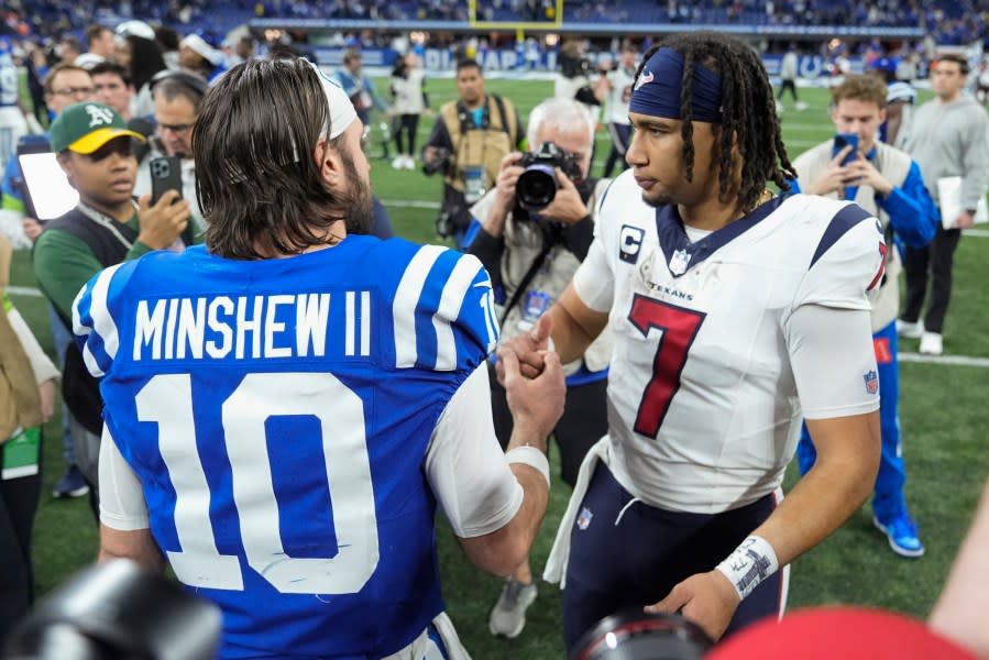 Houston Texans quarterback C.J. Stroud (7) shakes hands with Indianapolis Colts quarterback Gardner Minshew (10) after an NFL football game Saturday, Jan. 6, 2024, in Indianapolis. (AP Photo/Michael Conroy)