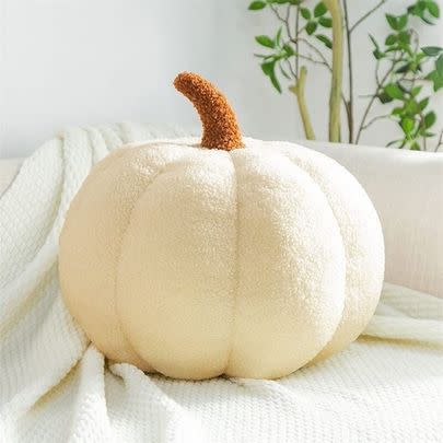 This plush pumpkin cushion