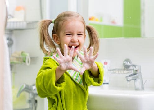 <span class="caption">It's not always easy to get them to wash their hands.</span> <span class="attribution"><a class="link " href="https://www.shutterstock.com/image-photo/child-washing-hands-showing-soapy-palms-324375455" rel="nofollow noopener" target="_blank" data-ylk="slk:Oksana Kuzmina/shutterstock;elm:context_link;itc:0;sec:content-canvas"> Oksana Kuzmina/shutterstock</a></span>
