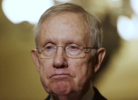 Senate Majority Leader Harry Reid (D-NV) speaks to reporters on the upcoming budget battle on Capitol Hill in Washington December 9, 2014. REUTERS/Gary Cameron