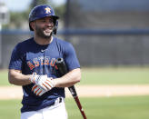 Houston Astros second baseman Jose Altuve (27) smiles before taking batting practice during spring training baseball practice, Tuesday, Feb. 18, 2020 in West Palm Beach, Fla. (Karen Warren/Houston Chronicle via AP)