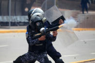 <p>Riot police fires tear gas toward supporters of Salvador Nasralla, presidential candidate for the Opposition Alliance Against the Dictatorship, during a protest while awaiting for official presidential election results in Tegucigalpa, Honduras, Nov. 30, 2017. (Photo: Jorge Cabrera/Reuters) </p>