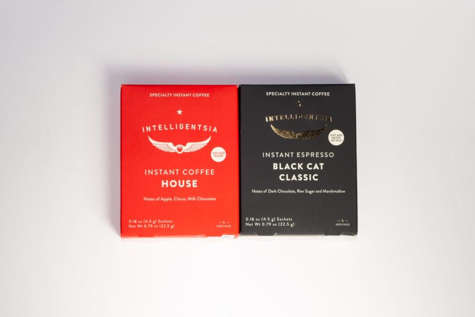 A red box and a black box of Intelligentsia Coffee, side by side