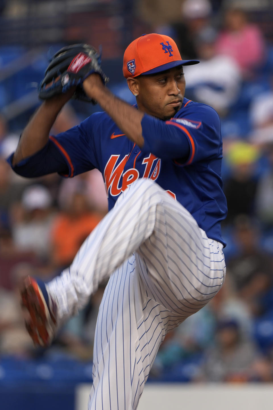 New York Mets pitcher Edwin Diaz throws during the fifth inning of a spring training baseball game against the Miami Marlins Monday, March 11, 2024, in Port St. Lucie, Fla. (AP Photo/Jeff Roberson)