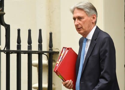 FILE PHOTO: Britain's Chancellor of the Exchequer Philip Hammond leaves Downing Street in London, September 11, 2018. REUTERS/Toby Melville
